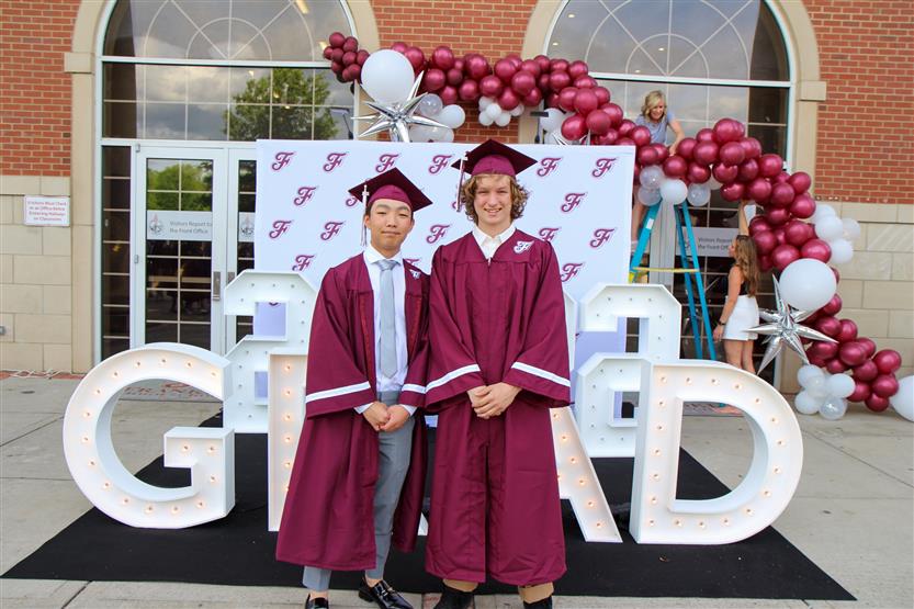 Graduates wearing maroon robes
